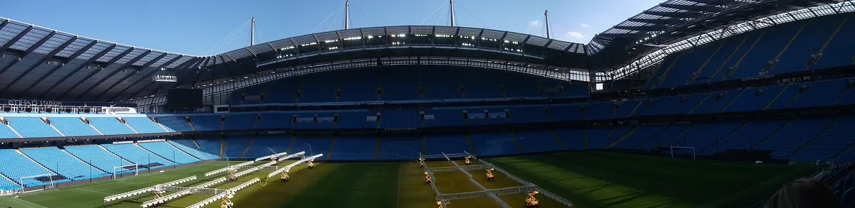 Wide real panorama across the interior of the City of Manchester Stadium